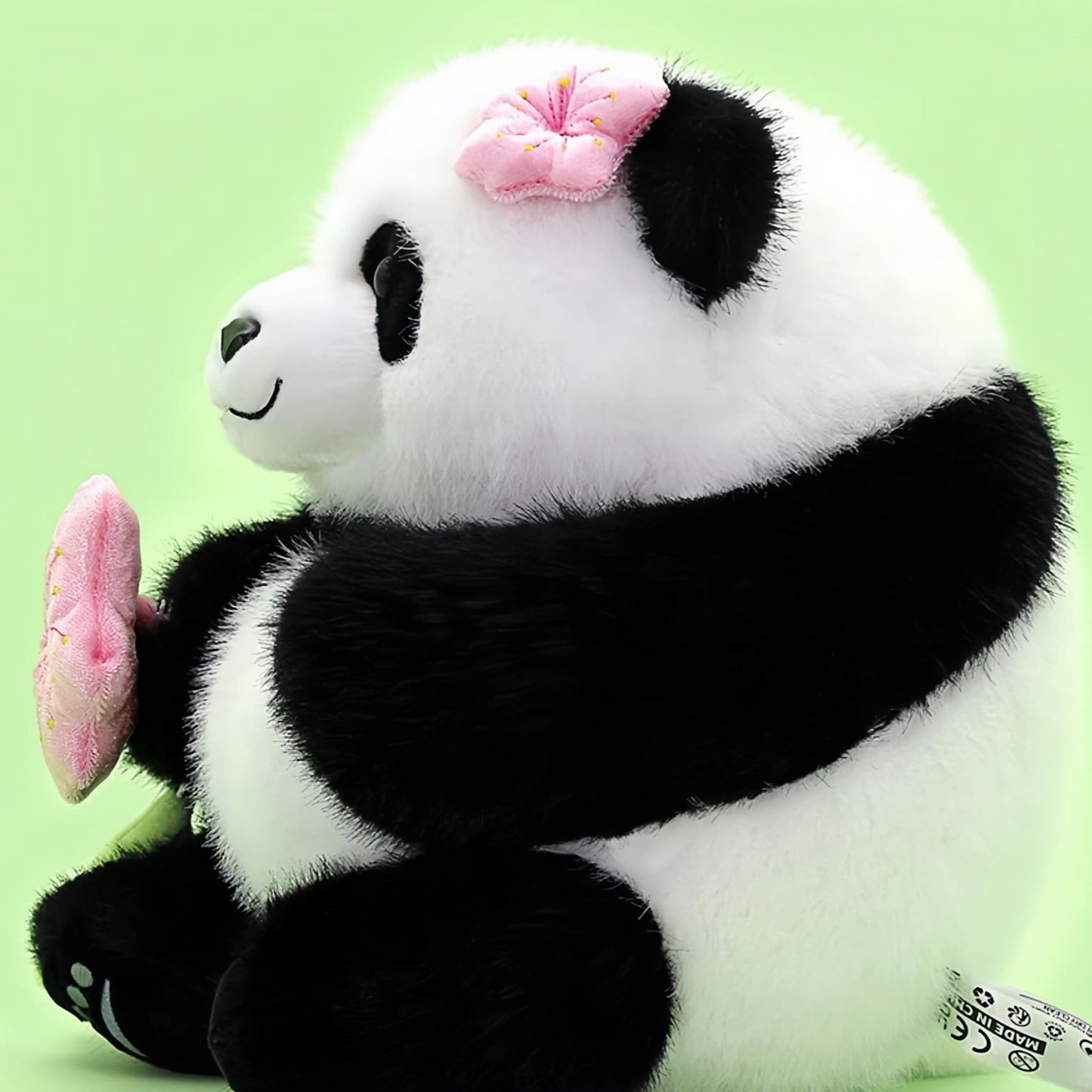 ダンシングブロッサムパンダぬいぐるみ – 回転する花のサプライズ付きフアフア🌸🐼